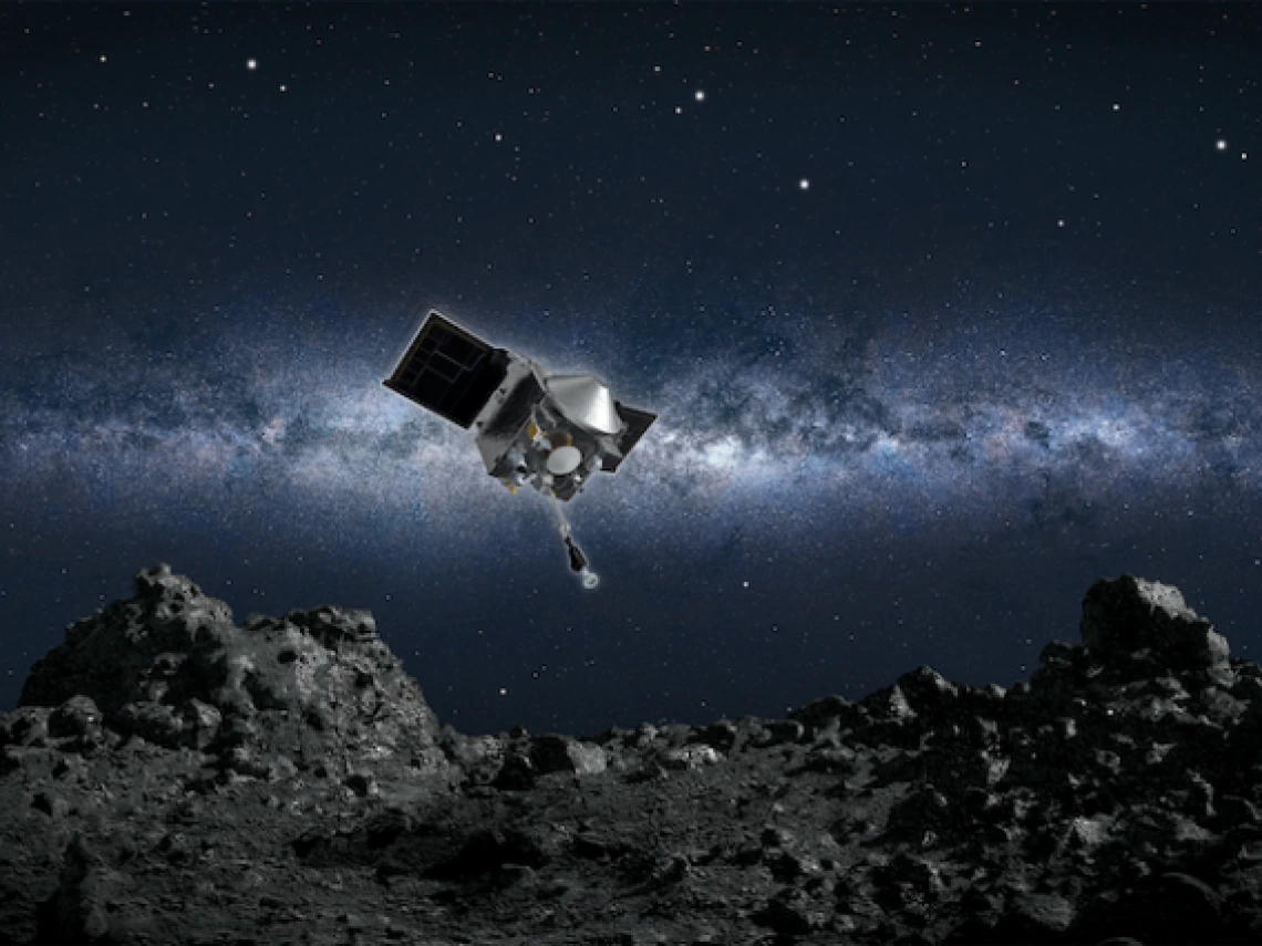 a spacecraft hovering over a rocky asteroid