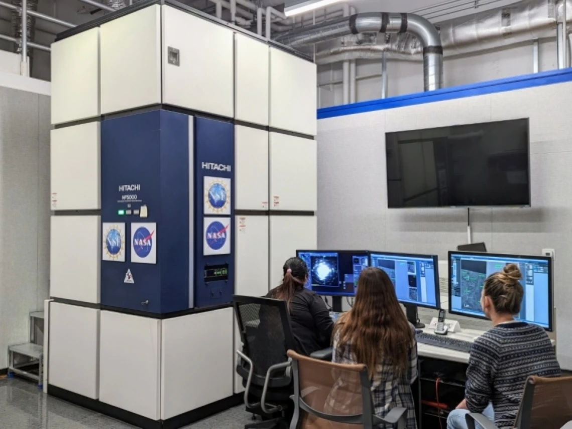 Students study a meteorite sample using the transmission electron microscope, or TEM, at the Kuiper Materials Science Facility. 